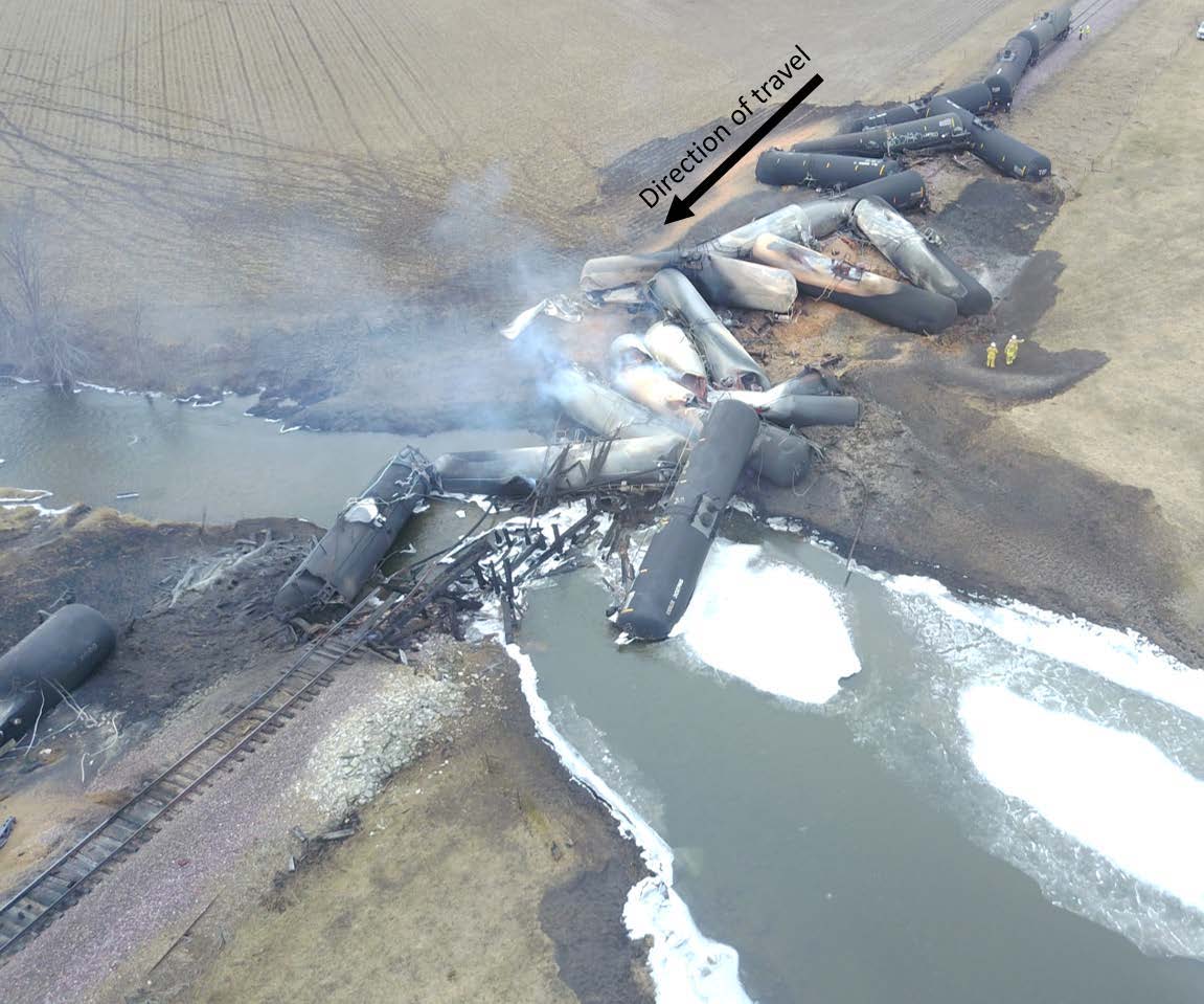 Aerial photograph of the derailed train and the damaged track.