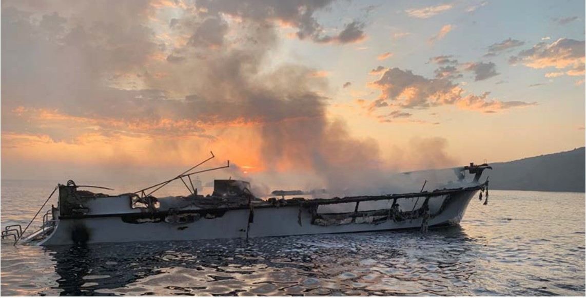 ​​​Photo of Conception’s burned hull at dawn on Sept. 2, 2019, prior to sinking. (Credit: Ventura County Fire Department)​