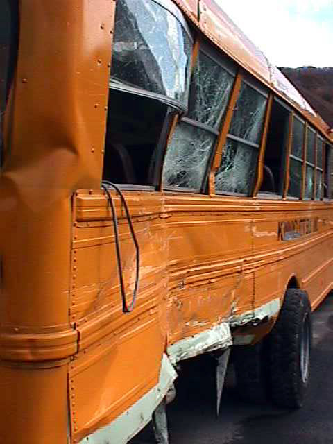 Exterior crush damage of school bus.