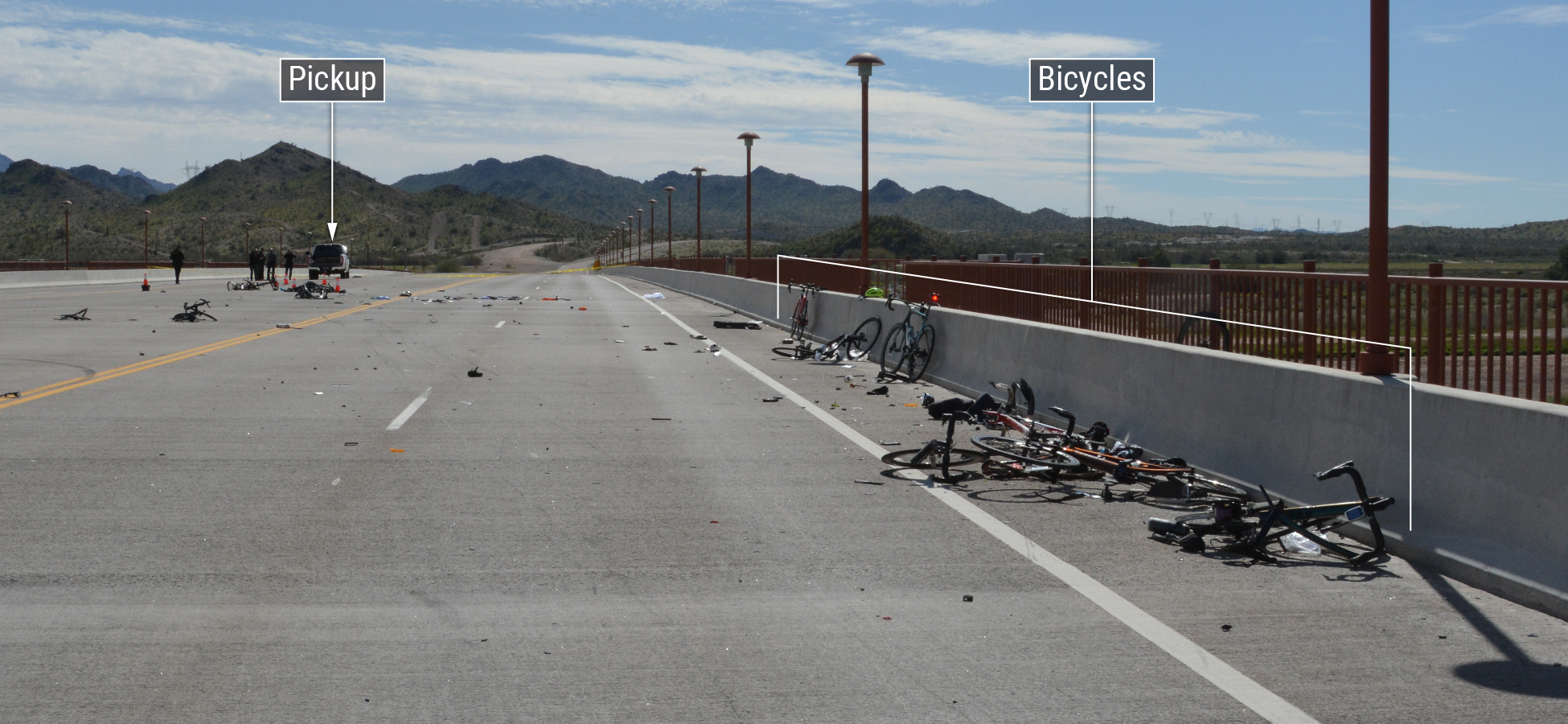 Aftermath of the crash showing the final rest position of the truck and some of the involved bicycles, as well as debris from th