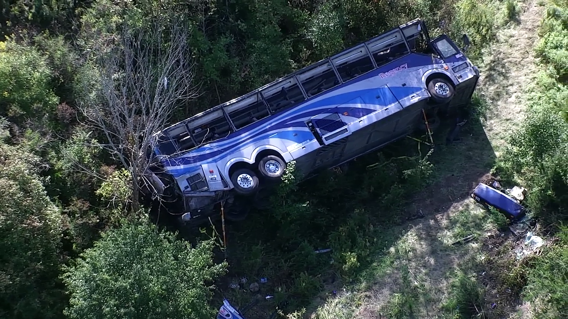 Overhead view of the 2014 Prevost motorcoach at rest in the I-84 center median. (Source: New York State Police)