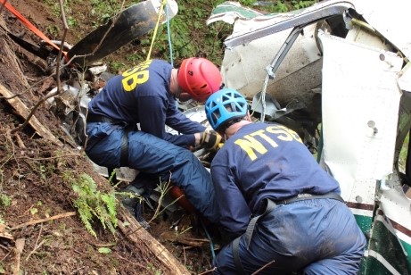 , NTSB investigators Brice Banning and Clint Crookshanks are working at the scene of the June 25, 2015, crash of a Part 135 
